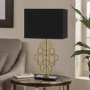 Luxury bedside lamp featuring a sculptural geometric frame and natural marble base, ideal for sophisticated bedroom décor.