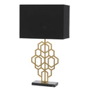 Akron Large Table Lamp displayed on a luxury bedside table, featuring a geometric antique gold metal frame, black fabric shade, and elegant marble base.