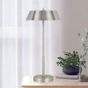 Modern designer desk lamp enhancing a creative studio with integrated LED technology and streamlined minimalist design.