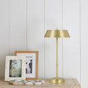 Elegant Allure LED Table Lamp creating ambient lighting on a hallway console with a sophisticated metallic finish and timeless aesthetic.