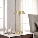 Premium contemporary table lamp installed in a boutique hotel room, combining luxury finishes with convenient touch-control LED lighting.