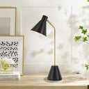 Black metal desk lamp positioned next to a laptop, creating an organised home office with integrated USB charging convenience.