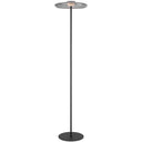 Amity LED Floor Lamp positioned beside a contemporary sofa, featuring a slim iron frame with a smoke glass disc diffuser for elegant ambient lighting.