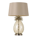 Ananas Table Lamp displayed on a luxury bedside table, featuring a hand-cut glass pineapple base with an antique chrome finish and elegant fabric drum shade.