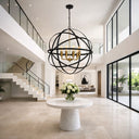 APPOLLO 8 Lights Modern interior with a large black spherical chandelier, white table, and staircase.