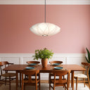 Large modern fabric pendant light featuring a sculptural layered shade, adjustable cable suspension, and designer ceiling lighting for contemporary interiors.