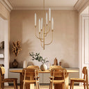 Modern 6-light LED chandelier featuring handcrafted glass shades, elegant gold leaf arms, and designer ceiling lighting for contemporary interiors.
