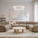 Contemporary circular LED pendant light for dining rooms, kitchen islands, living spaces, and commercial interiors with adjustable suspension.