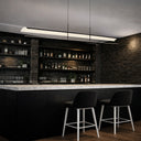 Modern linear pendant light for kitchen islands and dining tables featuring integrated LED technology and premium sand-textured finish.