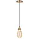 Atico 1 LED pendant light with champagne glass shade and warm 3000K illumination, creating elegant lighting above a contemporary dining table.
