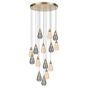 Atico 15 LED cluster pendant light with smoke and champagne glass shades, creating a stunning focal point in a luxury double-height foyer.