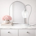 Luxury bedside lamp combining natural marble, decorative glass, and premium metal finishes for sophisticated interior styling.
