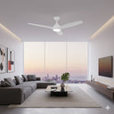 Modern living room with a Martec Avoca ceiling fan with LED Light , sectional sofa, coffee table, and cityscape view Lights and Fans Online .