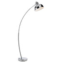 Modern arc floor lamp creating a stylish reading corner with its extended curved frame and focused downward illumination.