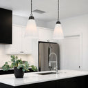 Contemporary hanging pendant light with smooth opal glass and black metal finish, ideal for minimalist home interiors.