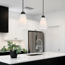 Modern kitchen island pendant light with opal glass shade and polished nickel finish, soft ambient ceiling lighting.