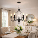 Candice 5-Light Candelabra Pendant Light in Dining room with a black chandelier, table setting, and decorative elements.