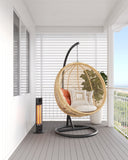 Cedar CO1200RB 1200W Mid-Wave Outdoor Heater Black – IP55 Infrared Patio Heater for Alfresco and Outdoor Entertaining Areas in an nice outdoor area with an egg chair on a balcony