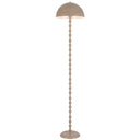 Modern floor lamp with a smooth dome-shaped shade directing comfortable reading light beside a sofa in a contemporary apartment.