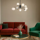 Elegant 9-light pendant with frosted tear glass shades and premium metal construction for boutique commercial interiors.