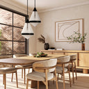 Harnon Pendant Light suspended above a modern dining table, featuring a textured glass conical shade with an antique gold finish for elegant ambient lighting.