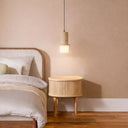 Designer single pendant with sculptural cast stone body, integrated LED illumination, and elegant ceiling lighting for Japandi and minimalist interiors.