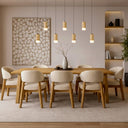 Designer linear hanging light showcasing seven textured cast stone pendants, energy-efficient LED illumination, and Scandinavian-inspired interior lighting.