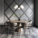 Marsten 5 Pendant Light Black five globe design in room with a round wooden dining table with six upholstered chairs in a modern dining room setting, featuring a textured gray diamond-patterned wall and a multi-light pendant fixture overhead.