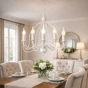 Candice  5-Light Candelabra Style Pendant Light – French White Finish in a Dining room with a white chandelier, table setting, and decorative elements.