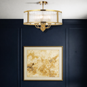 Architectural Norel 6 light chandelier with textured glass surround, contemporary drum design, and premium lighting for stylish dining rooms and living spaces.