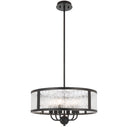 Modern drum pendant light featuring rippled glass panels, black metal frame, and designer ceiling lighting for contemporary living spaces.