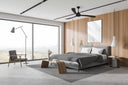 Designer smart ceiling fan Australia with WiFi app control and timber blades in Modern bedroom with a bed, ceiling fan, and large windows.