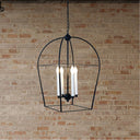Black adjustable spotlight bar installed on a ceiling across the feature wall