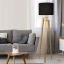 LUND Complete Floor Lamp Black in a Living room with gray sofa, wooden coffee table, and tall floor lamp with black shade.