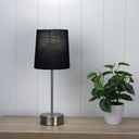 Modern brushed chrome lamp base with black shade