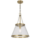 Olmont pendant light with textured glass shade and brushed nickel finish, creating elegant industrial lighting above a modern kitchen island.