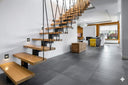 Quattro Recessed Tricolour LED Step Light in a Modern interior with wooden staircase and living room from Lights and Fans Online 