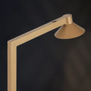 Luxury designer floor lamp enhancing a boutique hotel suite with premium marble construction and elegant ambient lighting.