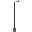 Satrom LED Floor Lamp positioned beside a contemporary lounge chair, delivering focused reading light with a slim architectural silhouette and green marble base.