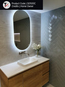 SO500C premium back-lit LED bathroom mirror with cool white lighting in a Modern bathroom vanity with illuminated mirror and wooden cabinet.