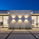Martec Sorrento Tricolour LED Exterior Wall Light in a Modern house exterior with wall-mounted lights and glass doors from lights and fans online 