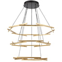 Grand three-tier LED chandelier suspended in a luxury foyer, creating a dramatic architectural centrepiece with layered circular light rings.