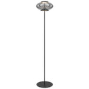 Tequo LED Floor Lamp positioned beside a contemporary sofa, featuring a smoked glass dome and slim black frame for elegant ambient lighting.