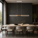 Slim contemporary pendant suspended above a boardroom table, providing uniform workspace illumination with integrated LED technology.