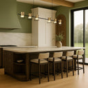 Designer linear chandelier creating functional task lighting above a breakfast bar in a contemporary open-plan home.
