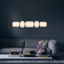 Designer Torso 5 LED Pendant Light with five diamond-cut and rippled glass shades creating architectural statement lighting for modern homes.