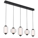Torso 5 LED bar pendant light with diamond-cut and rippled glass shades, creating modern kitchen island lighting for contemporary interiors.