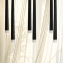 Designer linear pendant light with adjustable suspension, minimalist architectural form, and modern commercial or residential lighting.