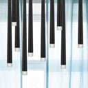 Designer statement pendant light for stairwells and high ceilings with minimalist architectural form and modern LED lighting technology.