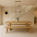 Tyson 6 Pendant Light with antique gold frame and opal matt glass shades creating warm contemporary ambient lighting.